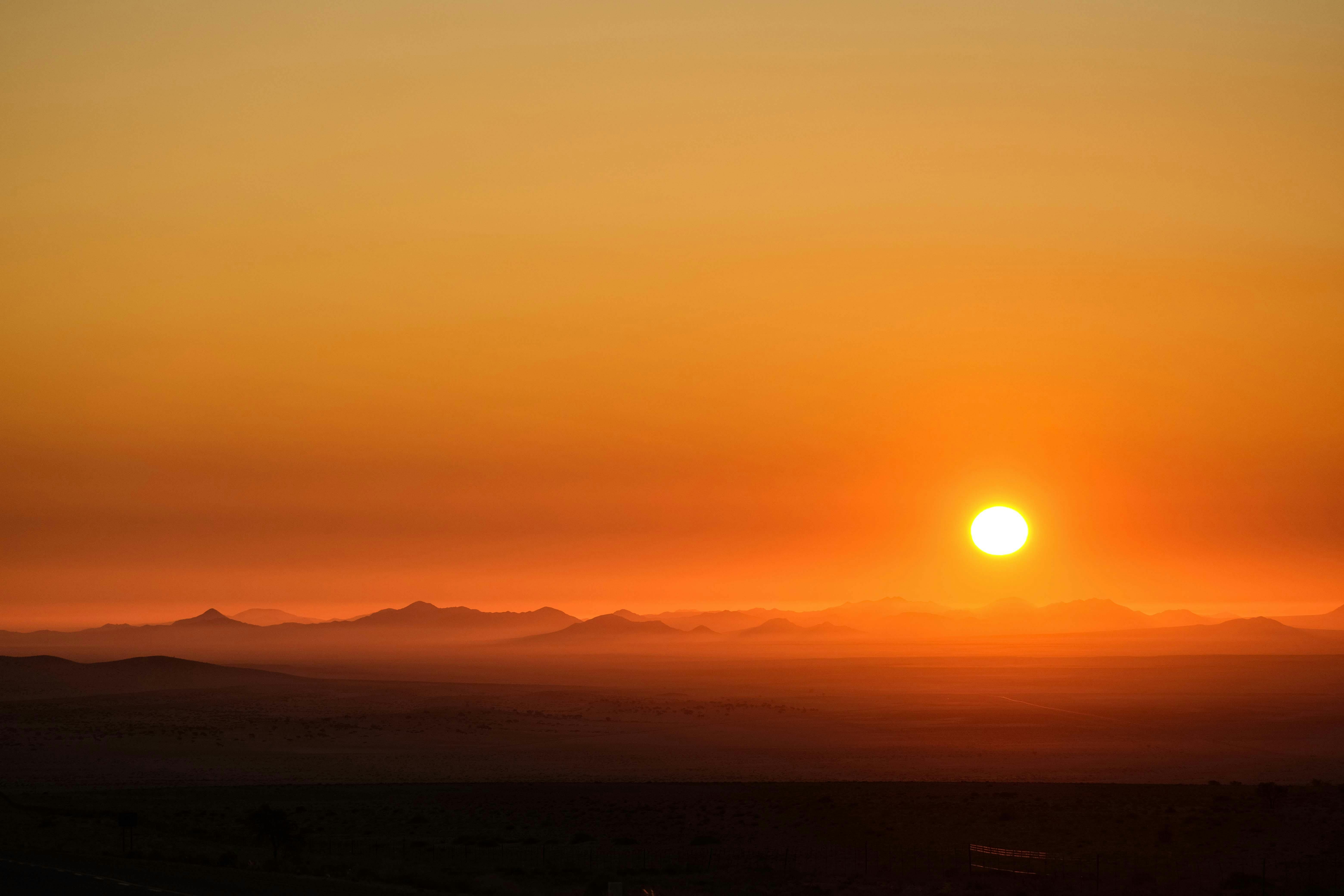 Breathtaking sunset casting warm hues over the desert mountains